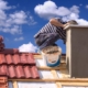 Image of a worker repairing a chimney with sealant.