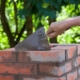Worker repairing chimey bricks
