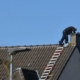 Side view of someone doing internal maintenance on a chimney