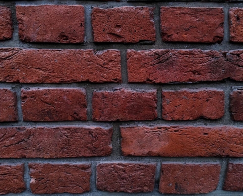 Old red brick wall, restoration of building