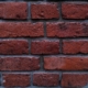 Old red brick wall, restoration of building